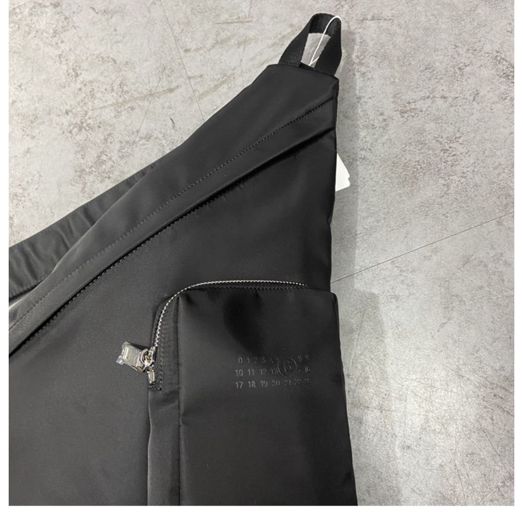 MM6 triangular cross body bag