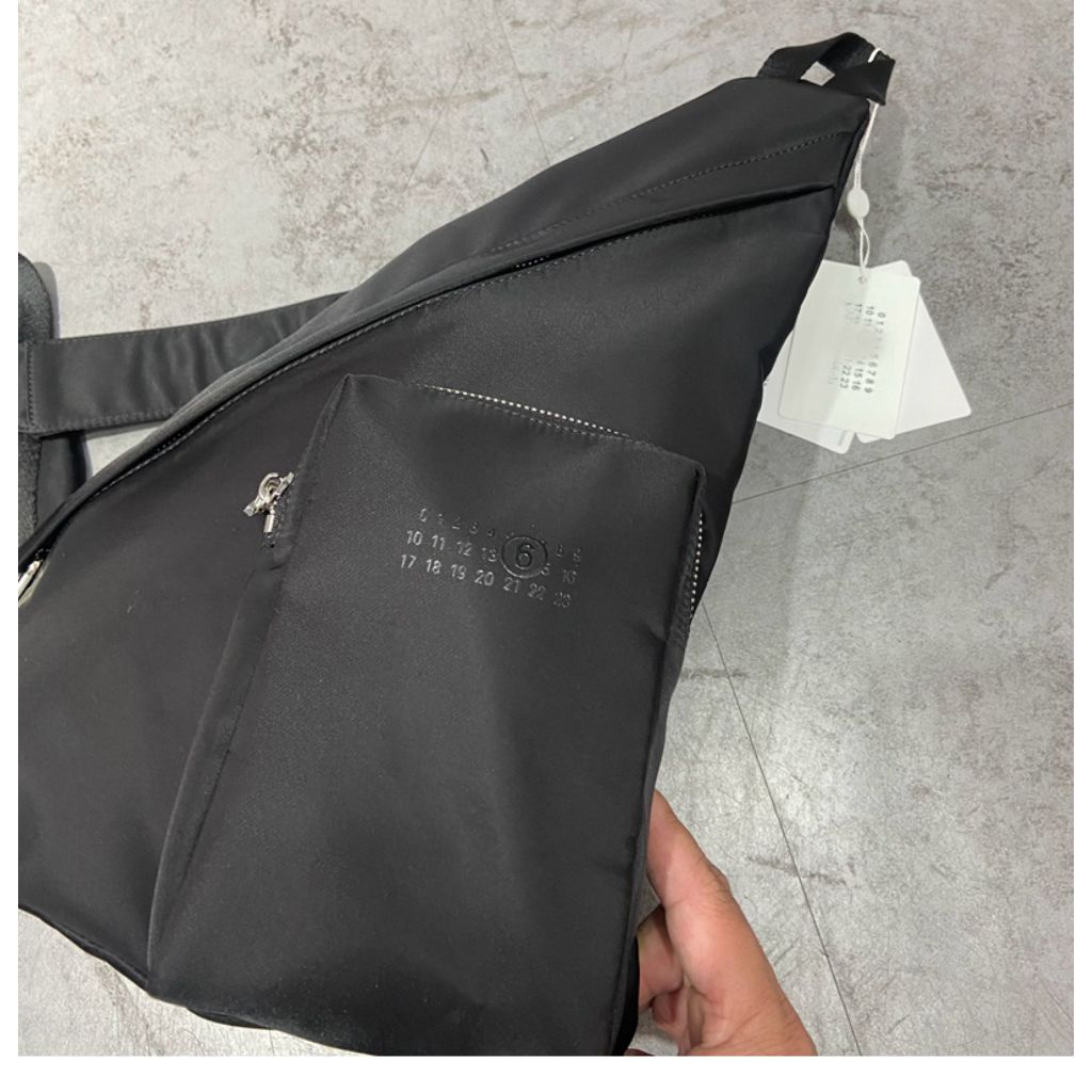 MM6 triangular cross body bag