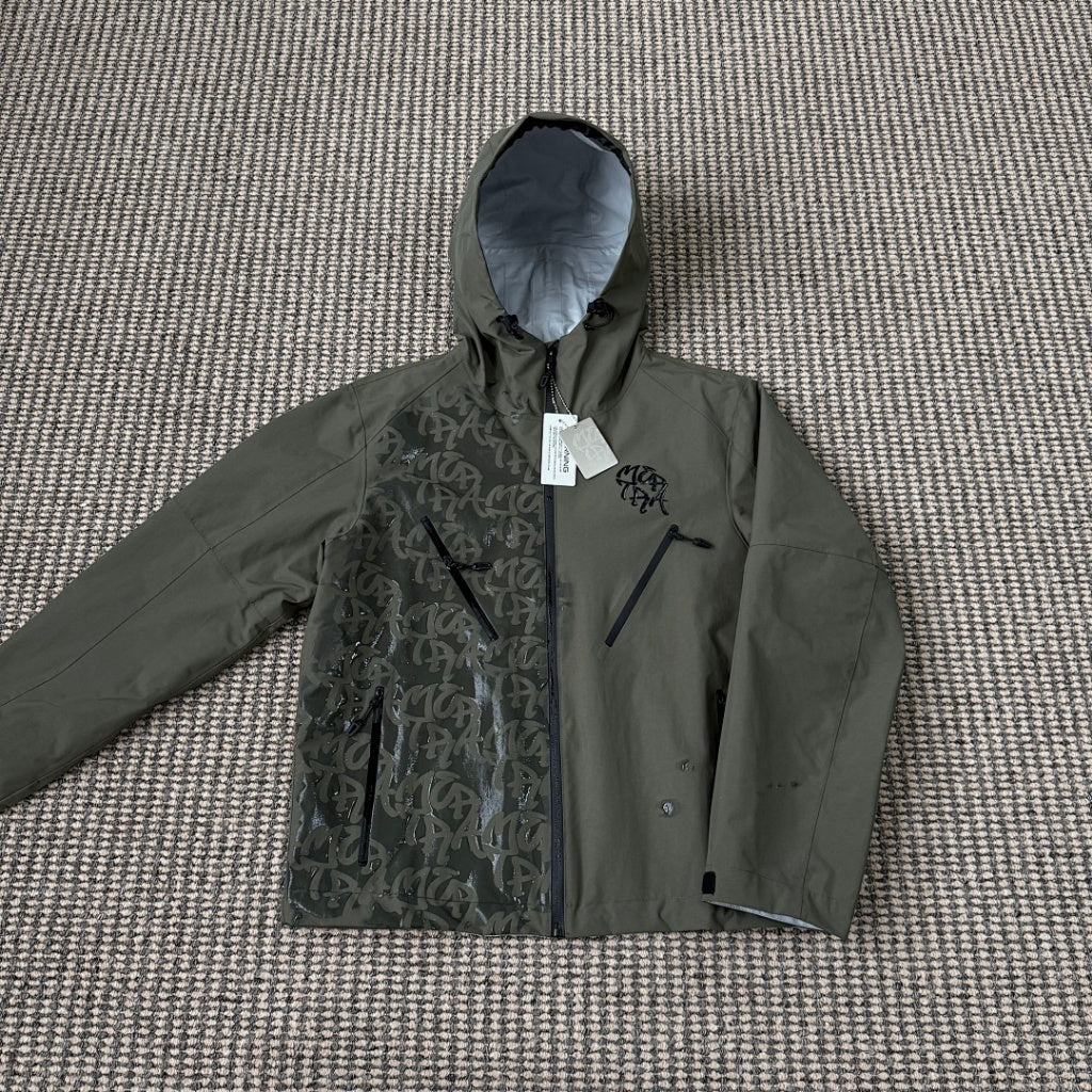 mertra -  Monogram Shell Jacket (Brown) - Water Reactive Monogram Pattern Effect
