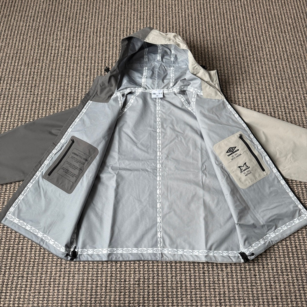MERTRA x Umbro Water Reactive Shell Jacket - BLACK & RED/ WHITE & GREY