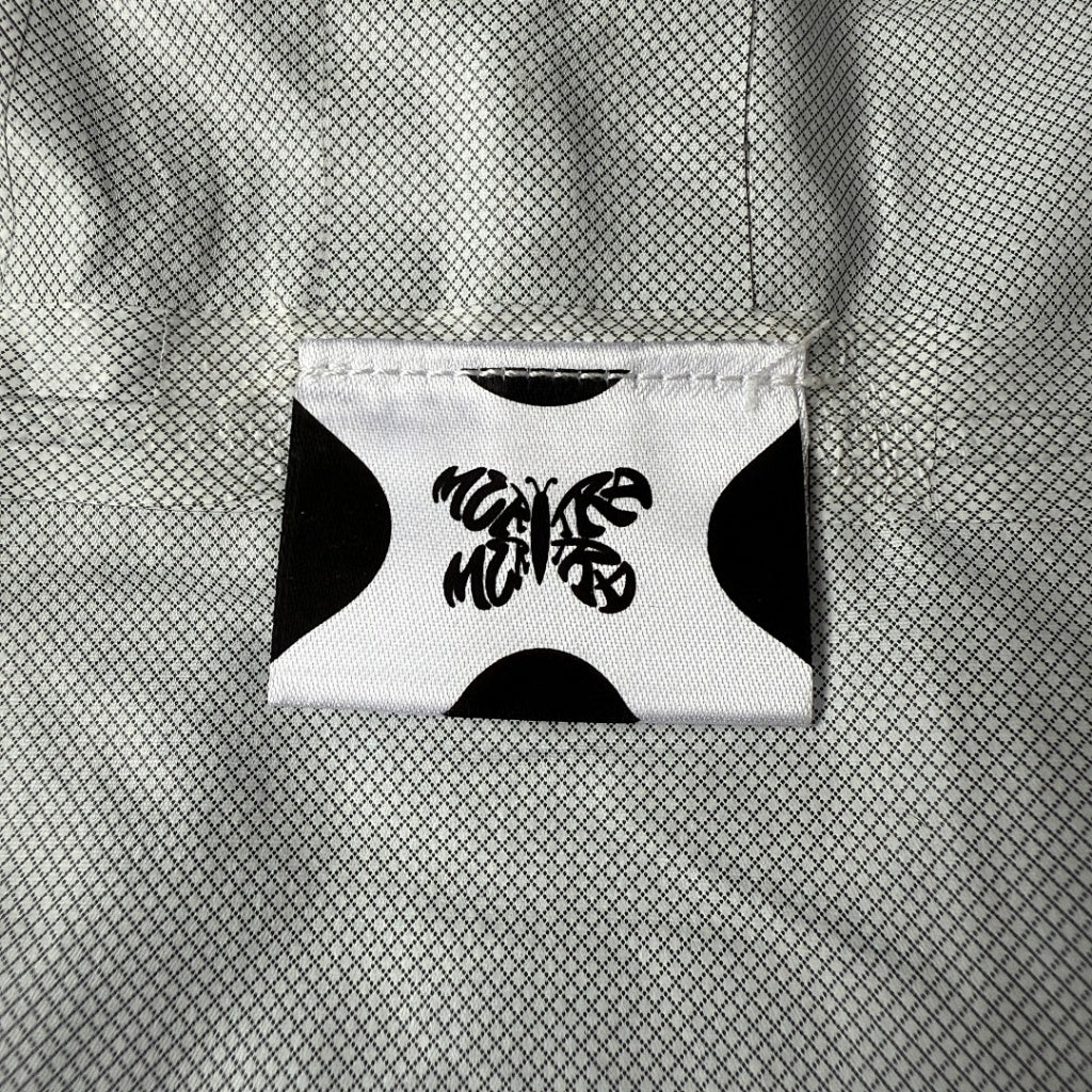 mertra -  Monogram Shell Jacket (Brown) - Water Reactive Monogram Pattern Effect
