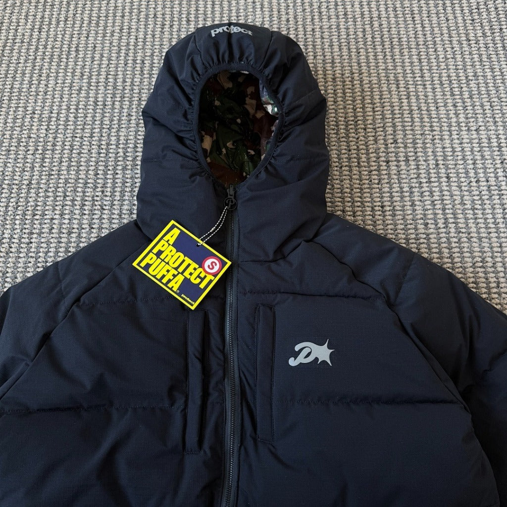 A PROTECT LONDON (@protect.ldn) - CAMO REVERSO PUFFA - Reversible Puffer Jacket